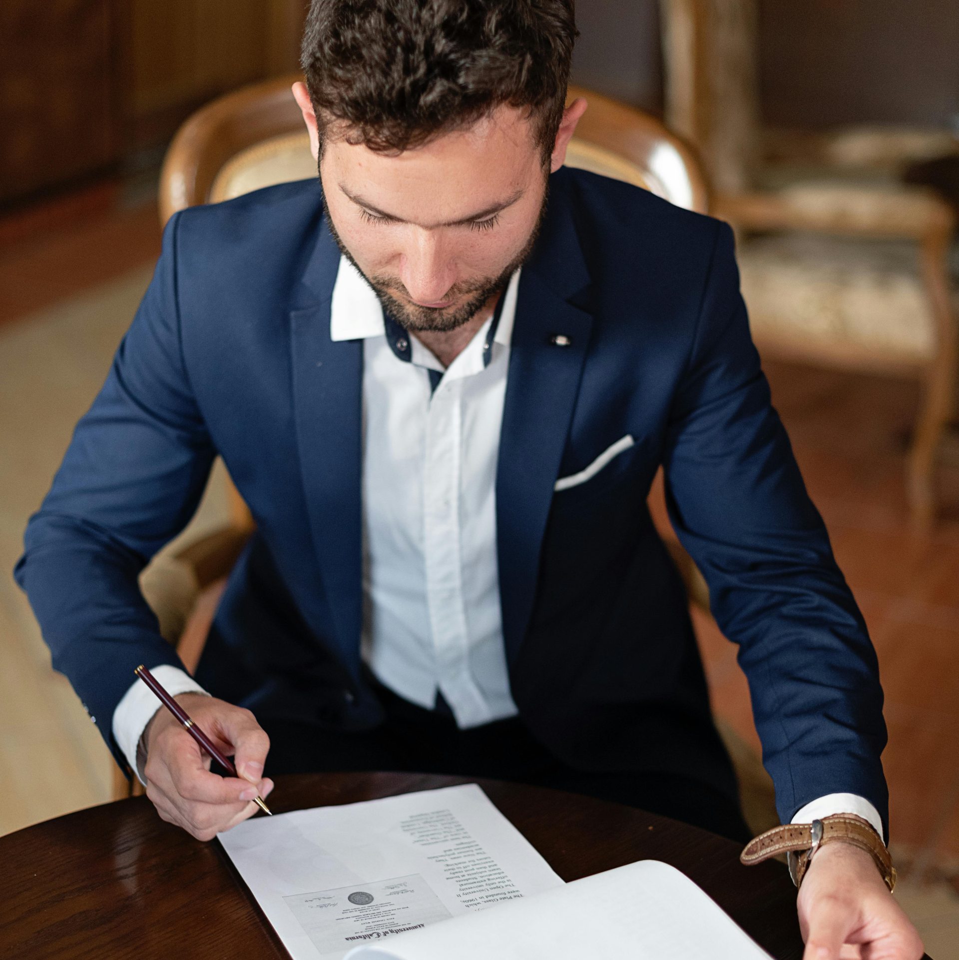 A Man Signing Papers